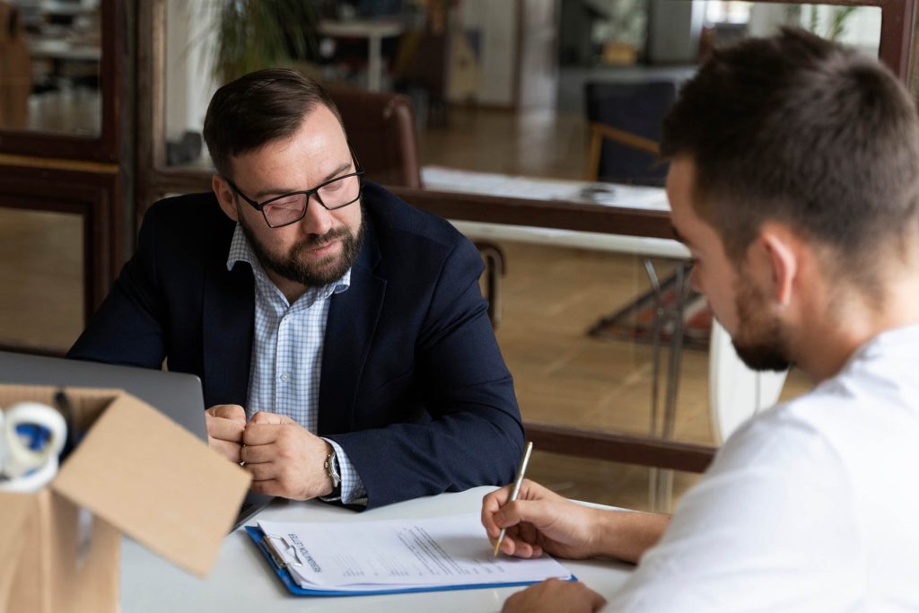 Nevada employee reviewing severance agreement with employment attorney before signing