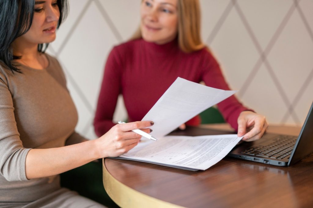 Nevada employee reviewing severance agreement before signing employment separation documents