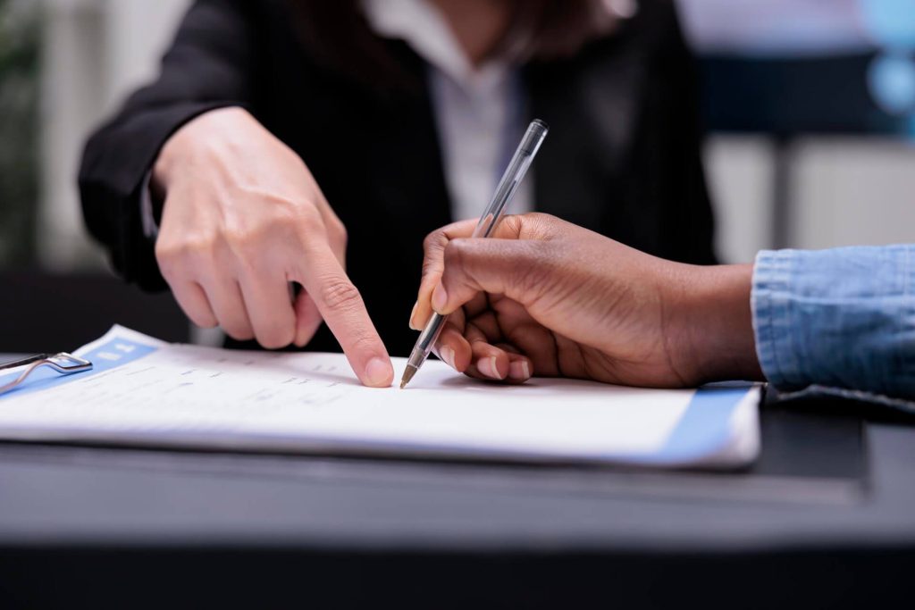 Nevada employee reviewing an employment arbitration agreement with an employment attorney