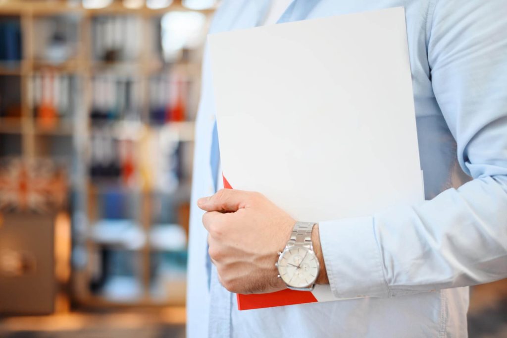 Nevada employee reviewing a workplace handbook with an employment attorney