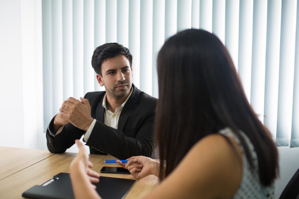 hostile-work-environment-nevada Nevada employee speaking with an employment attorney about a hostile work environment