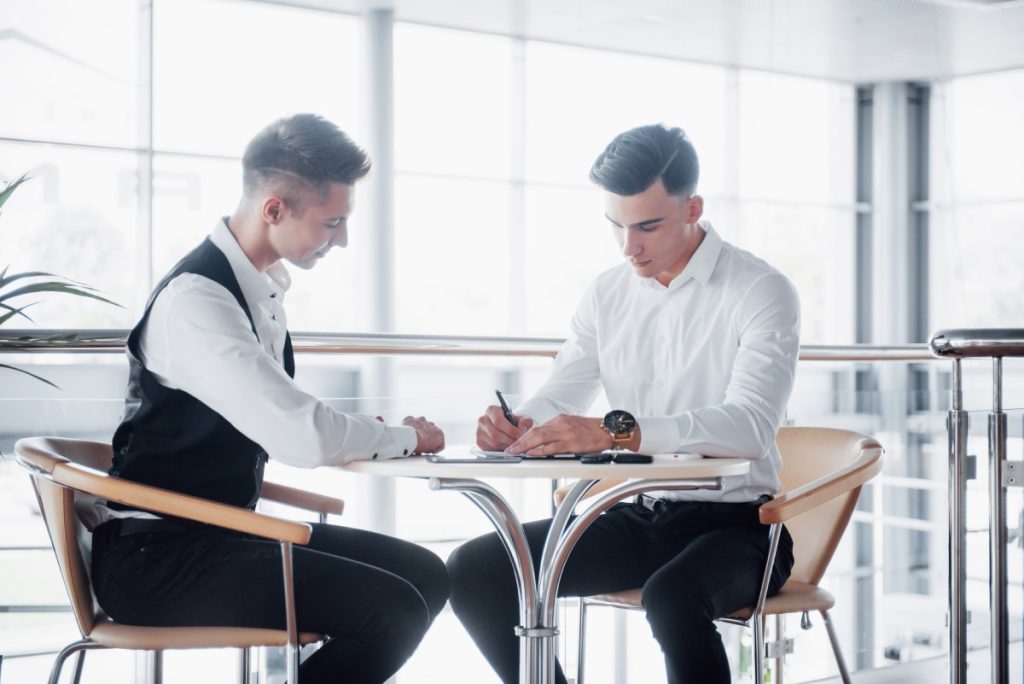 tip-pooling-stolen-tips-las-vegas Las Vegas hospitality employee reviewing tip pooling and wage rights with an employment attorney