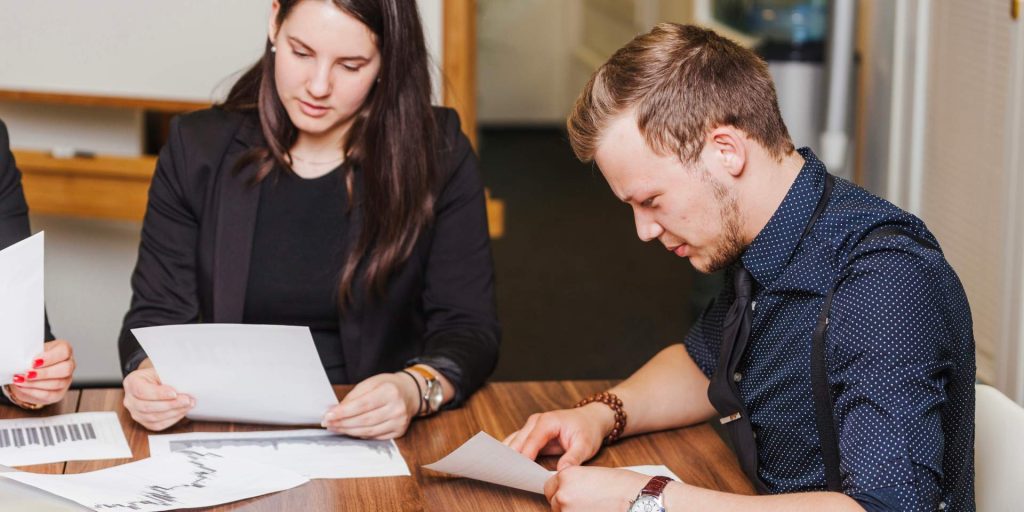 Employee reviewing a paycheck and wage deductions related to wage garnishment