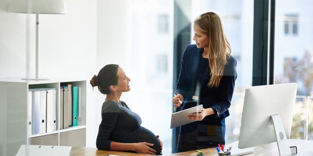 Pregnant employee meeting with Human Resources to discuss workplace accommodations in Nevada
