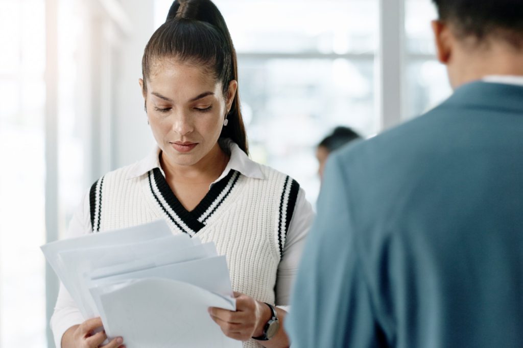 Nevada employee reviewing workplace records and termination documents