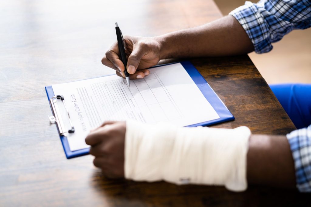 Employee in Nevada reviewing termination documents after filing a workers compensation claim