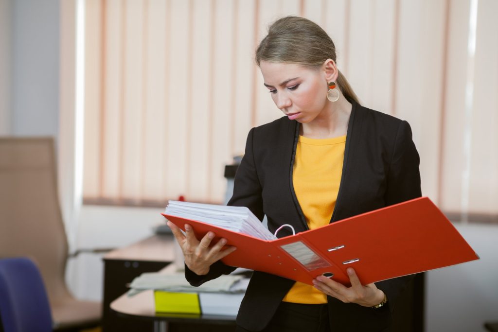 Employee organizing termination records and workplace evidence after being fired in Las Vegas
