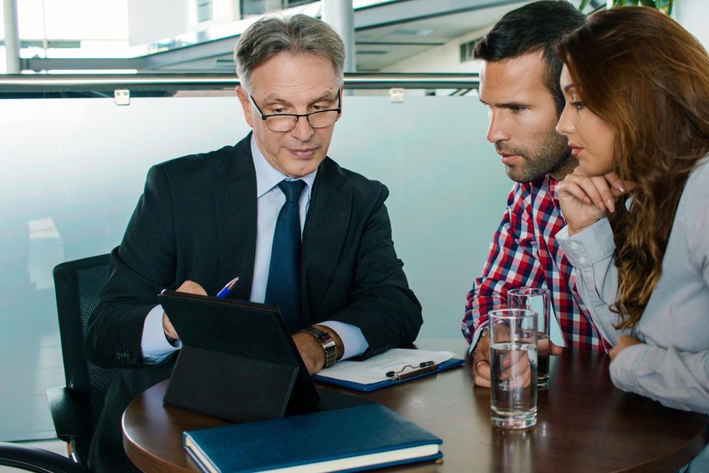 California employee reviewing a work schedule and tracking required meal periods, paid rest breaks, and workplace break compliance.