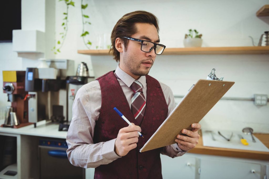 Hotel employee reviewing a split-shift schedule in Nevada