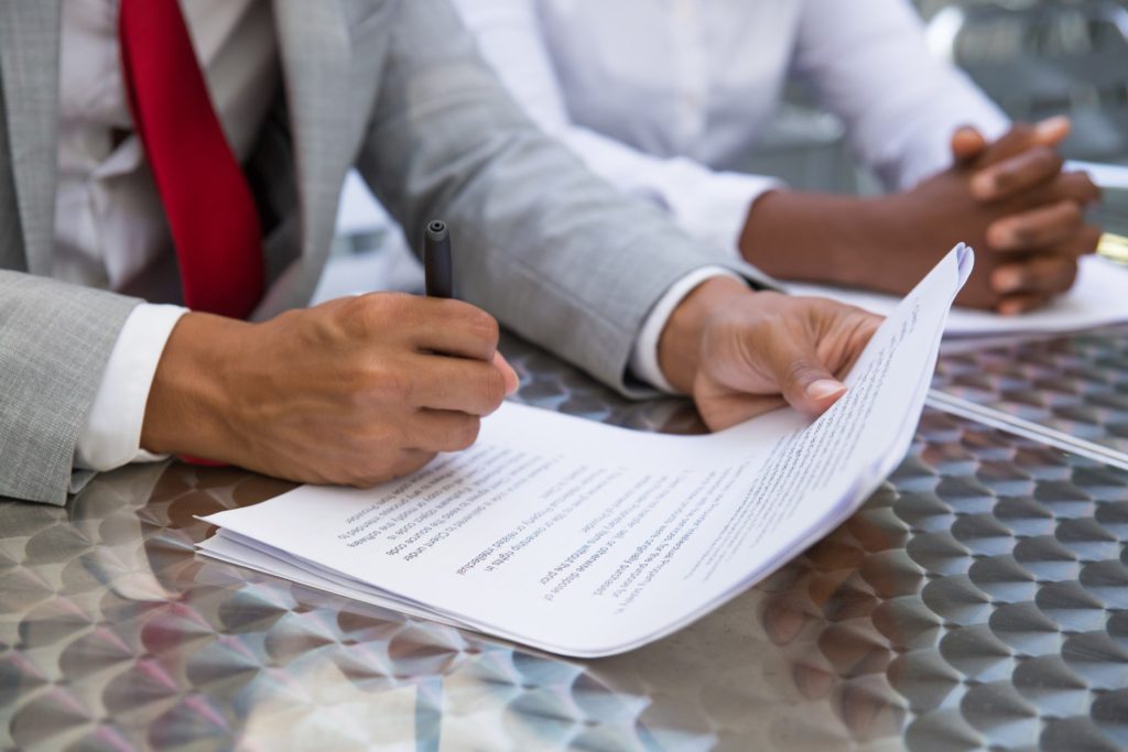 Employee reviewing a Nevada severance agreement covering severance pay, benefits, release of claims, and post-employment restrictions