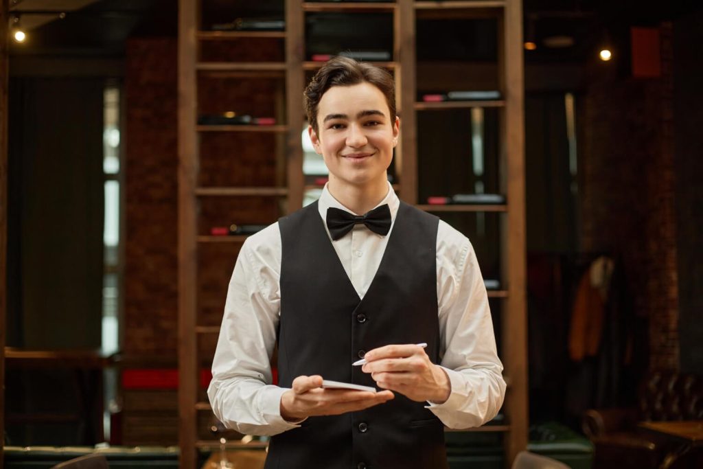 Restaurant service worker calculating wages and tips in Nevada