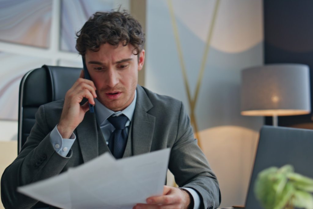 Employee reviewing a severance agreement after being fired in Nevada