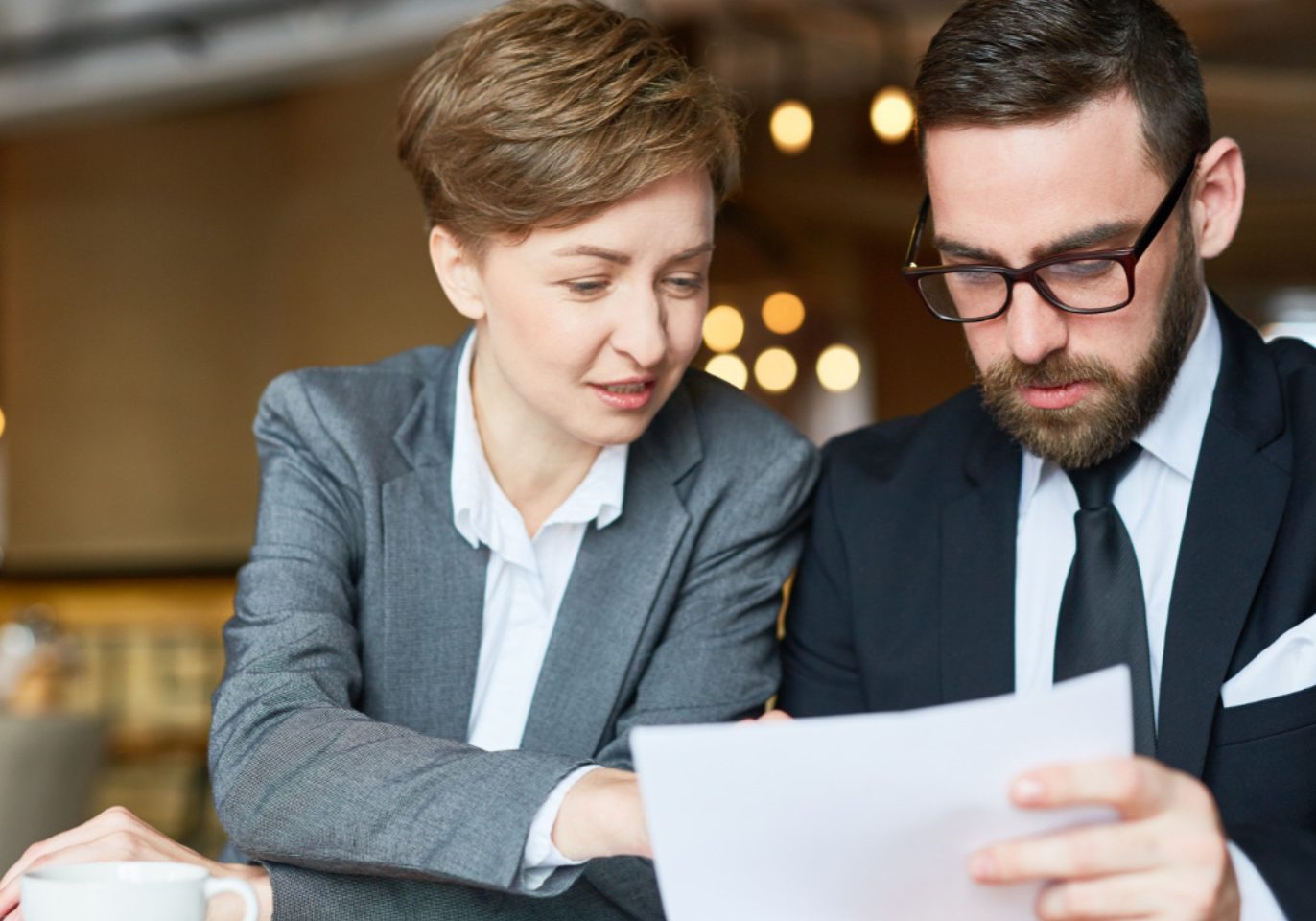 Employee reviewing a bonus and profit-sharing agreement with a Nevada employment attorney