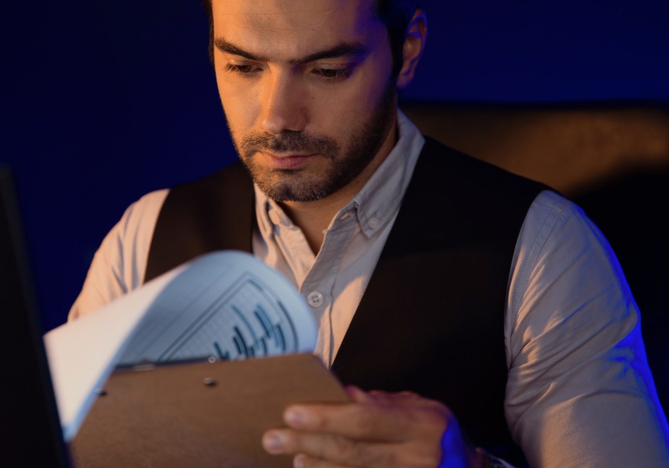 Casino employee reviewing documents after being fired from a Las Vegas casino