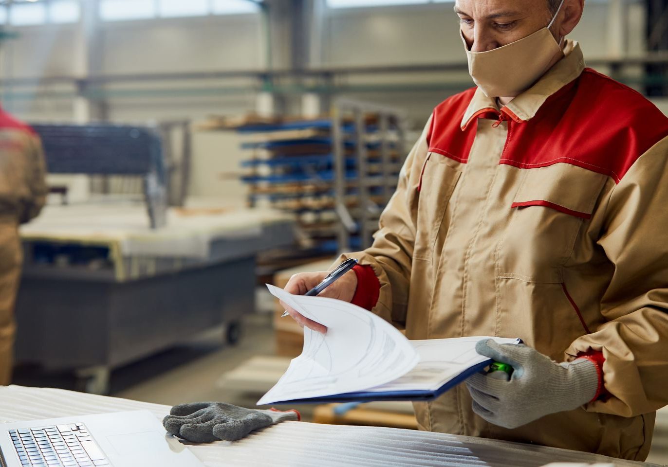 Reno warehouse worker reviewing workplace rights and pay records