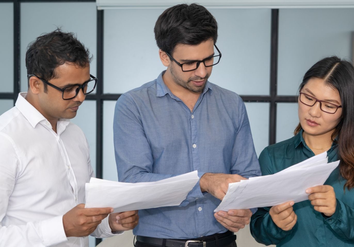 Nevada employees reviewing layoff notices during a workplace reduction in force